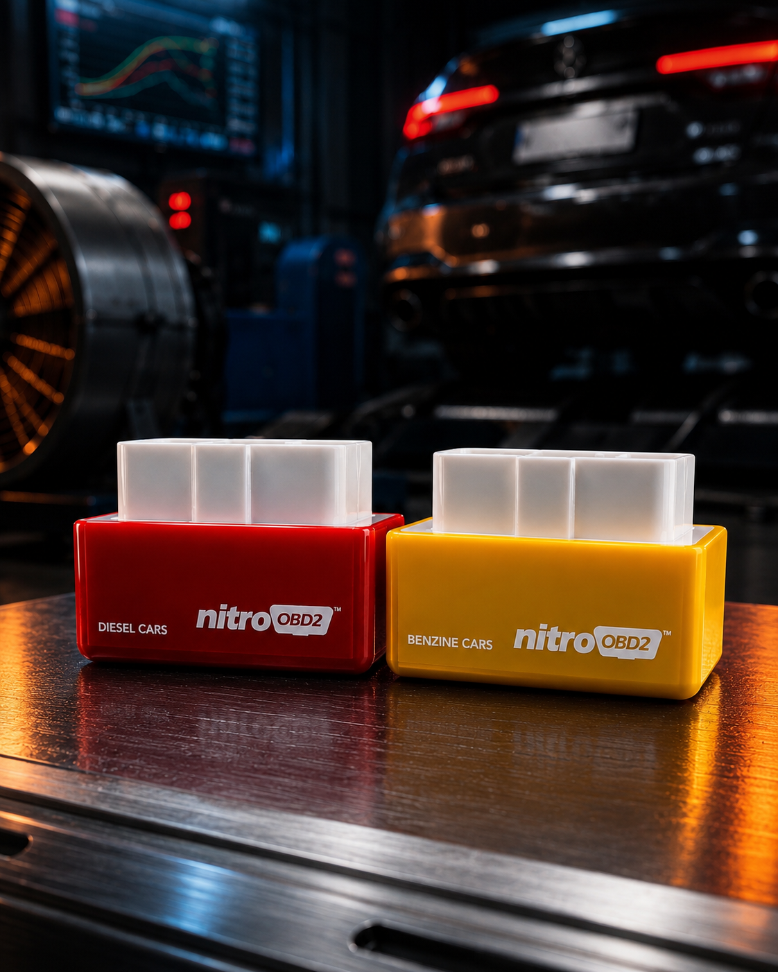 Nitro OBD2 Tuning Chips — Diesel (red) and Benzine (yellow) on workshop bench with dyno backdrop